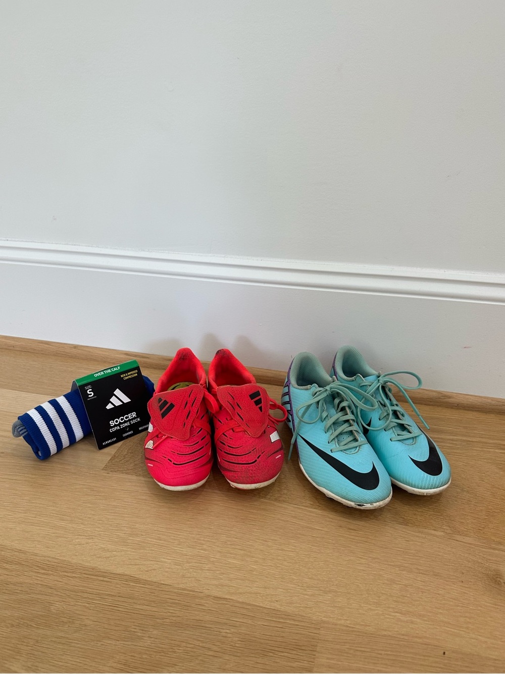 Lot of Adidas Cleats Size 1 1/2 and Nike Cleats Size 2, and soccer socks Size S